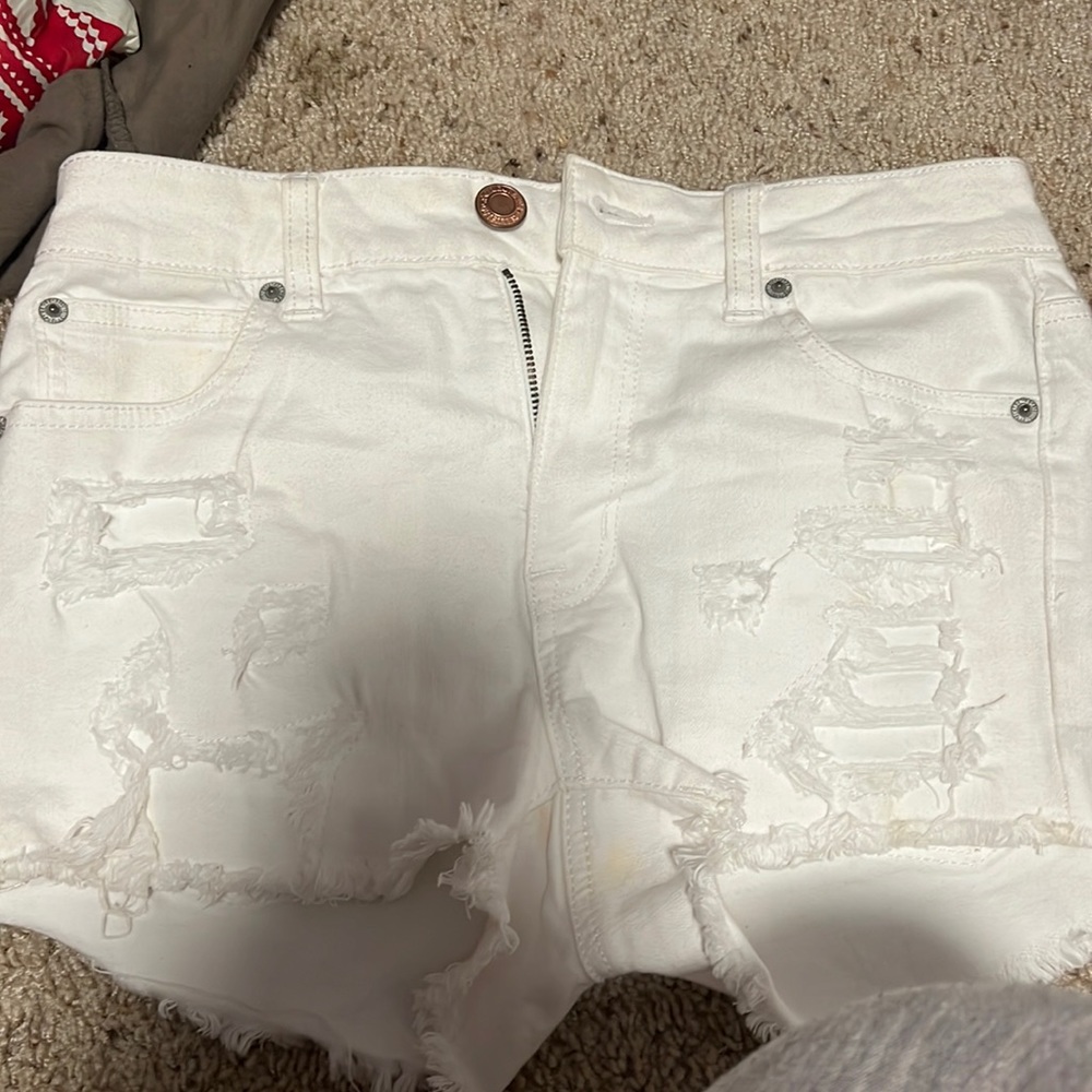 White patched ripped american eagle jean shorts